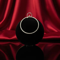 Elegant diamond hoop pendant on black display with red silk backdrop, The Manay jewelry