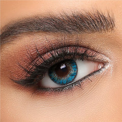 Turquoise blue cosmetic contact lens on brown eye, natural makeup, Buy Contacts Online