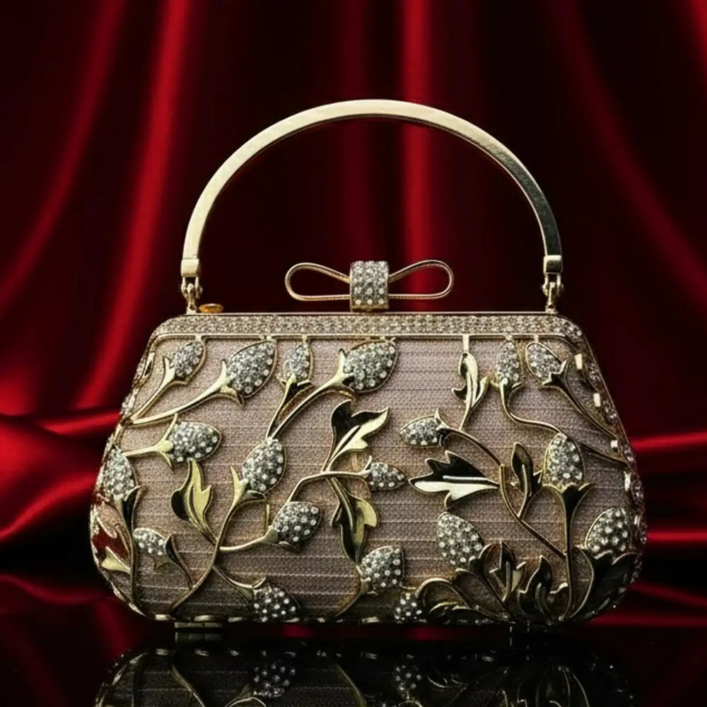 Elegant gold and crystal floral clutch purse on red satin background, The Manay