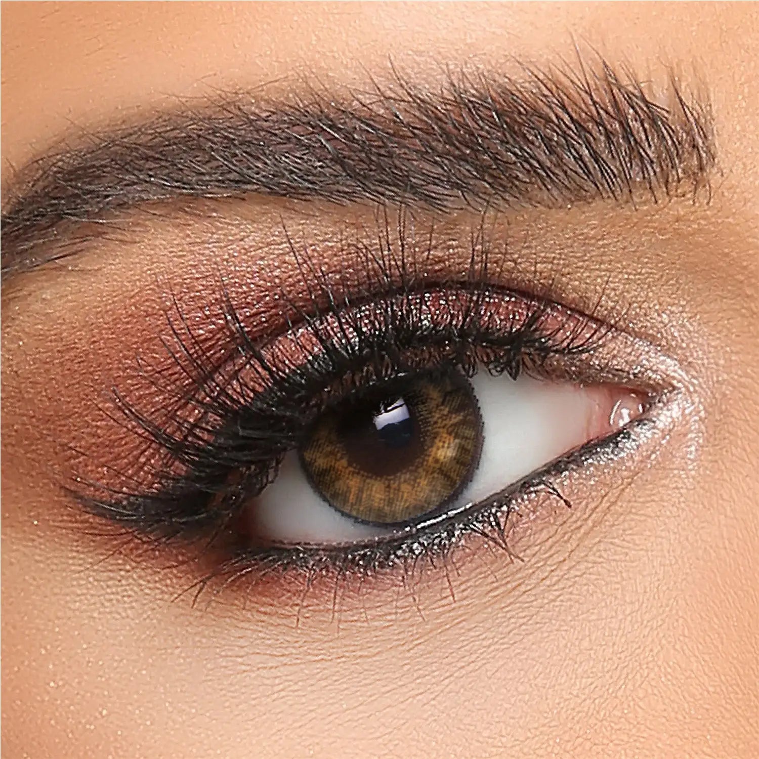 Pure Hazel colored contact lens on brown eye closeup with makeup, The Manay beauty product